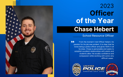 Officer Chase Hebert in uniform with Flag